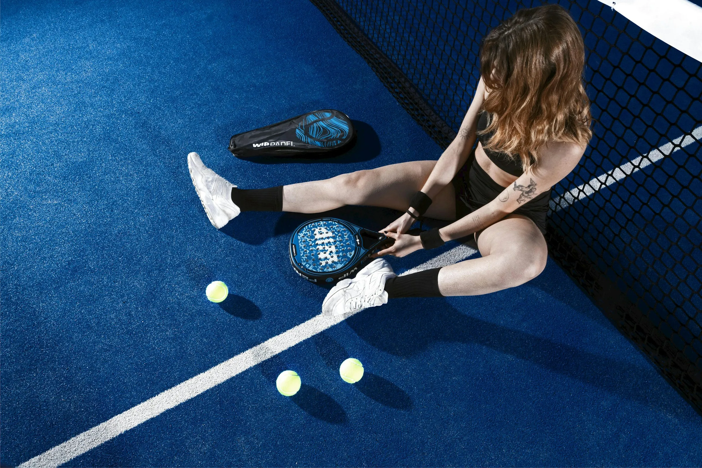 Woman on Blue Padel Court